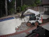 A Santa Cruz Pool removal often involves a bobcat
